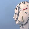 A surreal illustration portrait of a human head with an analog clock wrapped around the face and neck, conceptualizing the idea of time and life.