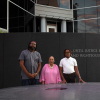 Alabama voters Evan Milligan (left), Sheyann Christburg-Webb and and Tyler Adams meet at the Civil Rights Memorial in Montgomery, Ala.