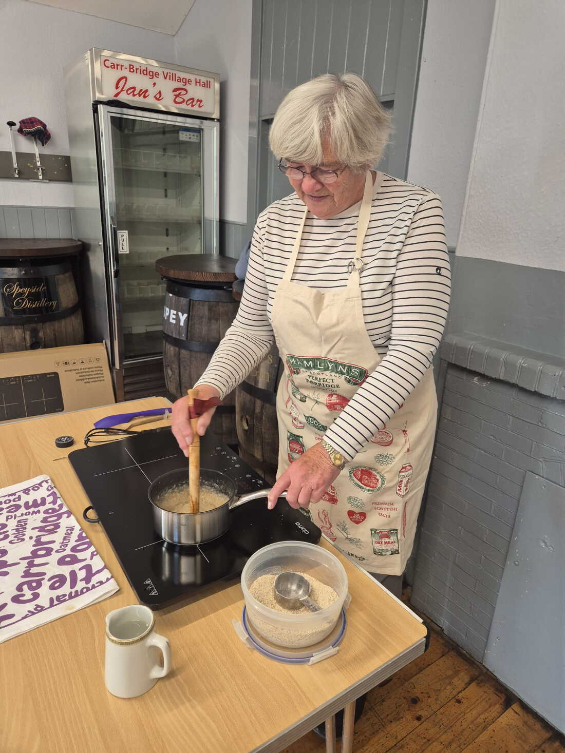 Hilary Shorter uses a wooden spurtle to mix her porridge.