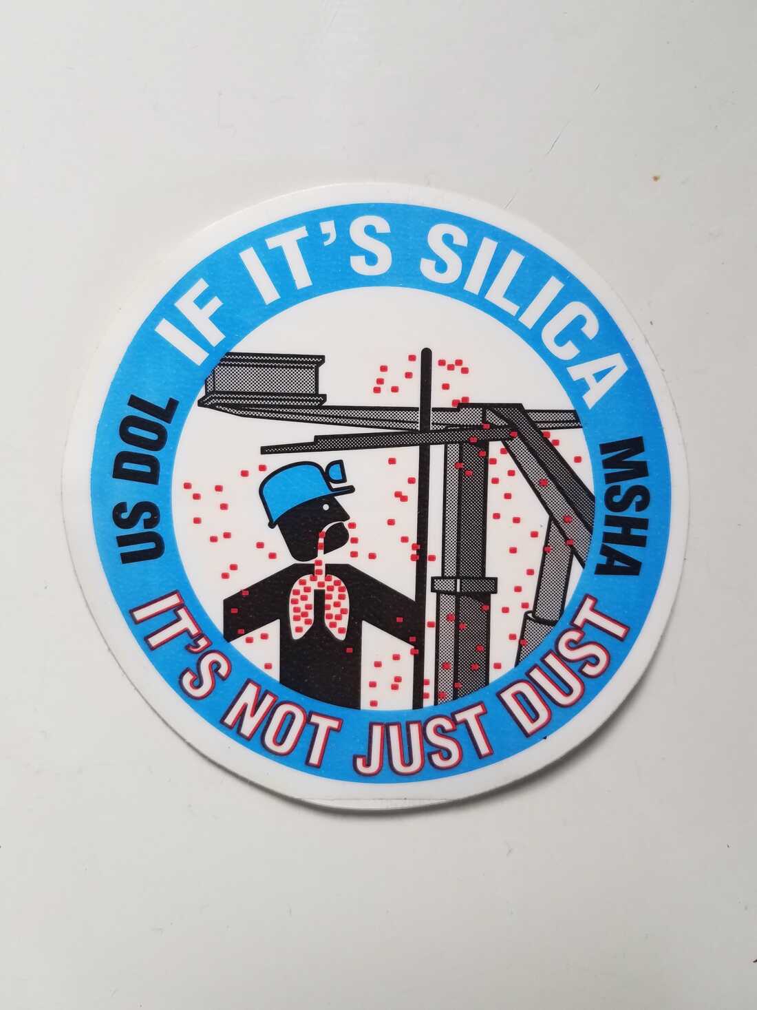 Even though the federal Mine Safety and Health Administration issued stickers like this warning of the danger of silica dust in coal mines, the agency under President Trump has joined a federal court in indefinitely delaying a new regulation aimed at preventing over exposure to the toxic dust.