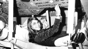Margaret Hamilton sits in mock-up of Apollo the command module on display at MIT in 1969.