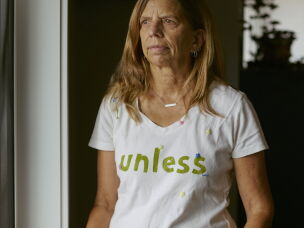 Daryl McCool poses inside her rebuilt home in Superior, Colorado. Her previous home was destroyed in the Marshall Fire, which swept through Superior and Louisville on Dec. 30, 2021.