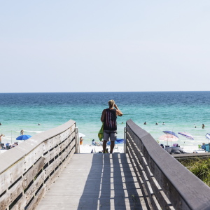 A beachgoer on the boardwalk at Ed Walline Regional Beach Access off of Highway 30A in Santa Rosa, Fla. on August 25, 2026.