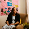Cynthia Montoya sits in the living room of her home, where photographs and memories of her daughter, Juliana, surround her in Thornton, Colo.