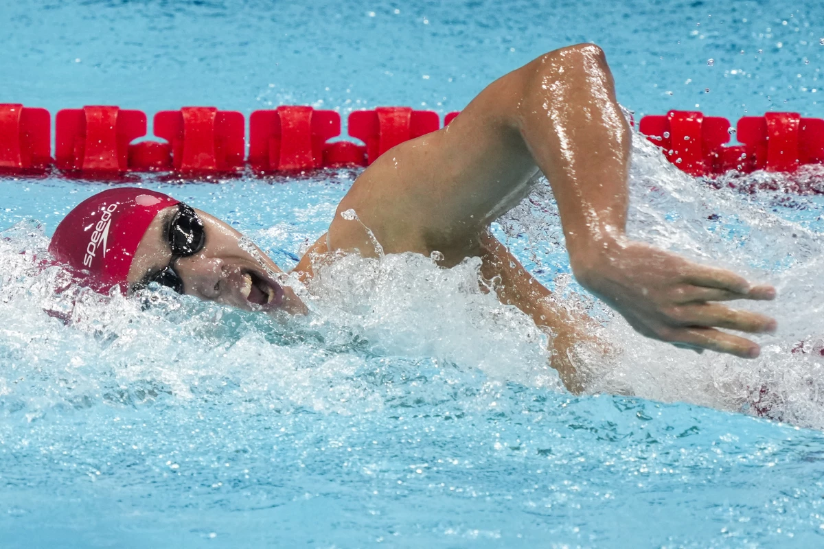 Fei Liwei, of China, competes during a heat in the men's 400-meter freestyle at the 2024 Summer Olympics on Saturday in Nanterre, France. He's one of 11 Chinese swimmers competing in Paris who face questions over a 2021 sports doping case.