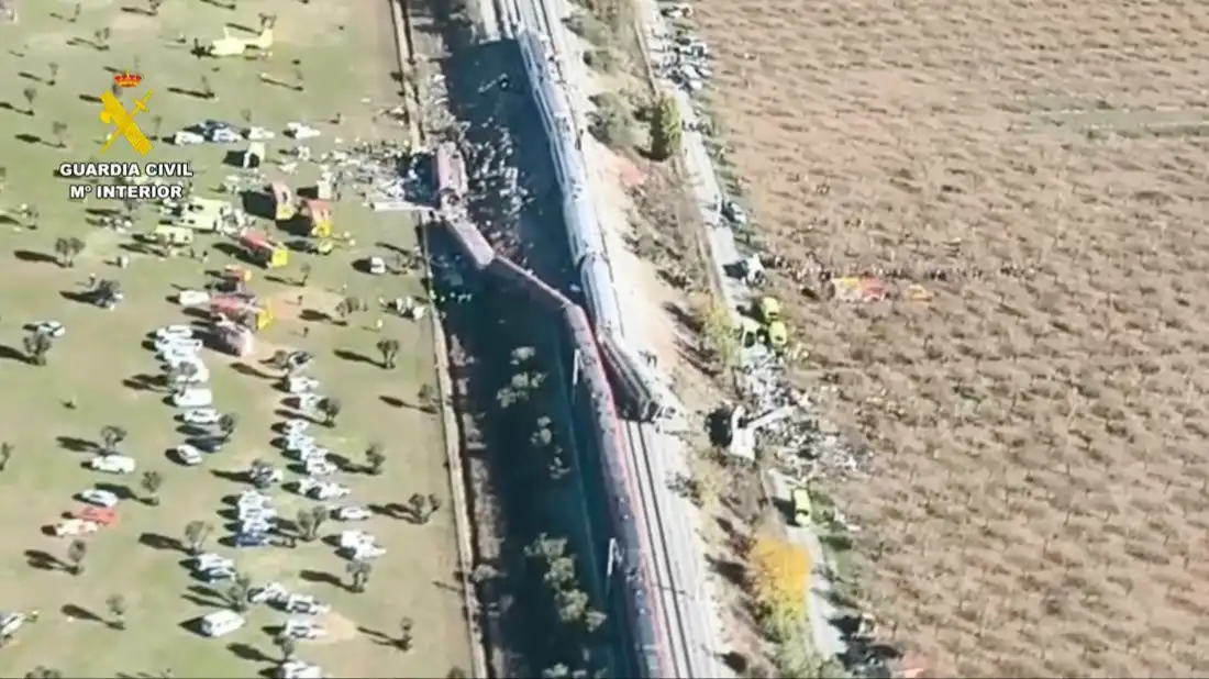 This screenshot taken from video provided by Spain's Guardia Civil shows an aerial view of train cars and first responders at the site of a collision between two trains in Urda, Spain, on Wednesday.