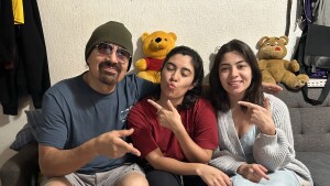 Francisco Urizar celebrates his 64th birthday with his daughters Nancy (center) and Francis. Since her father was taken into Immigrations and Customs Enforcement custody earlier in the week, Nancy has been frantically searching for clues about where, and why, he has been detained.