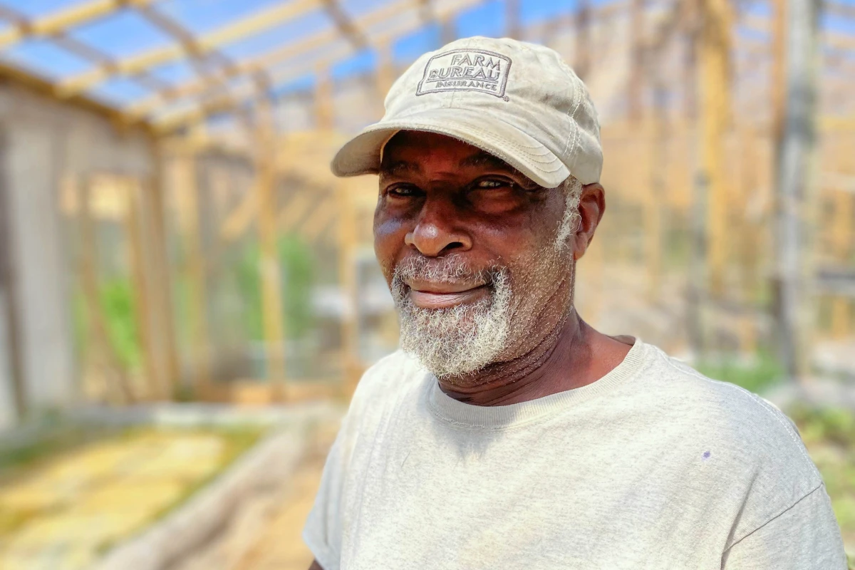 Phillip Barker, in the hydroponic growhouse on Olusanya Farm LLC, which he owns with his wife in Oxford, N.C.