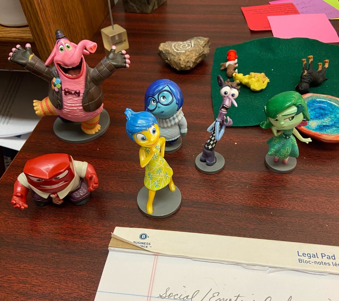 Kristi Zybulewski keeps Inside Out emotion figurines on her desk.