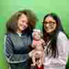 Sh’Amir Spencer and daughter Amira pose with Rx Kids co-director Mona Hanna at the Hurley Children’s Center clinic in Flint, Mich. Spencer and her daughter are part of the first cohort of moms and babies in the program, which launched in the city in January.