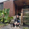 Kelly MacDonald holds her dog in front of her five bedroom home in a Cincinnati suburb on September, 11 2026.