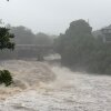 A view of the rising water levels at the Wainaku Street Bridge in Hilo on the Big Island of Hawaii, Saturday, Aug. 15, 2026.