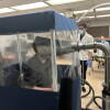 A person breathes inside the Gesundheit II, a machine that allows scientists to study the behavior of pathogens when they're exhaled. Research like this is at risk amid the Trump administration's proposed funding cuts.