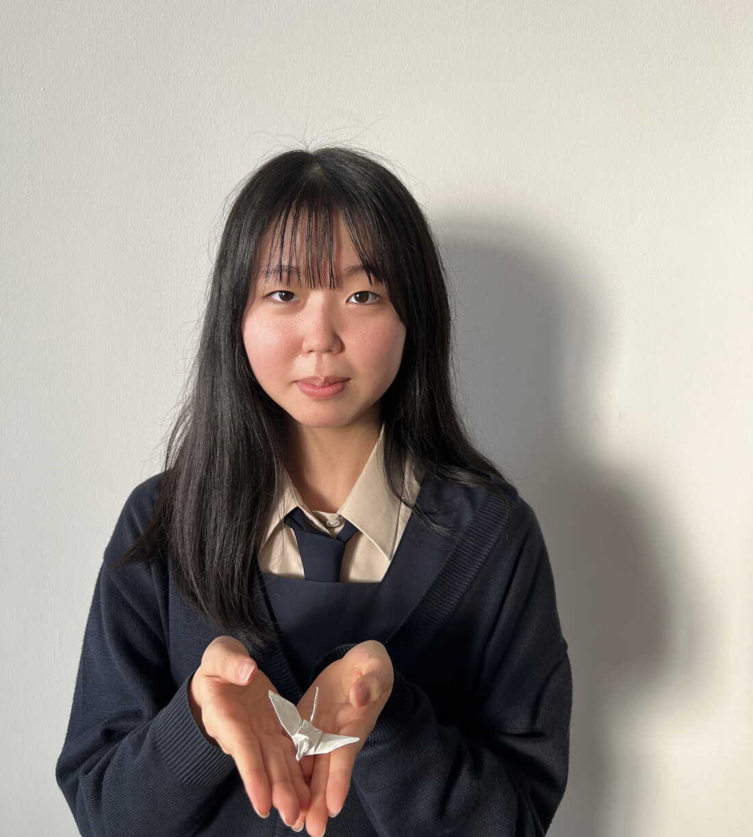 Rika Matsuda with the origami crane from her unsung hero, in 2023.