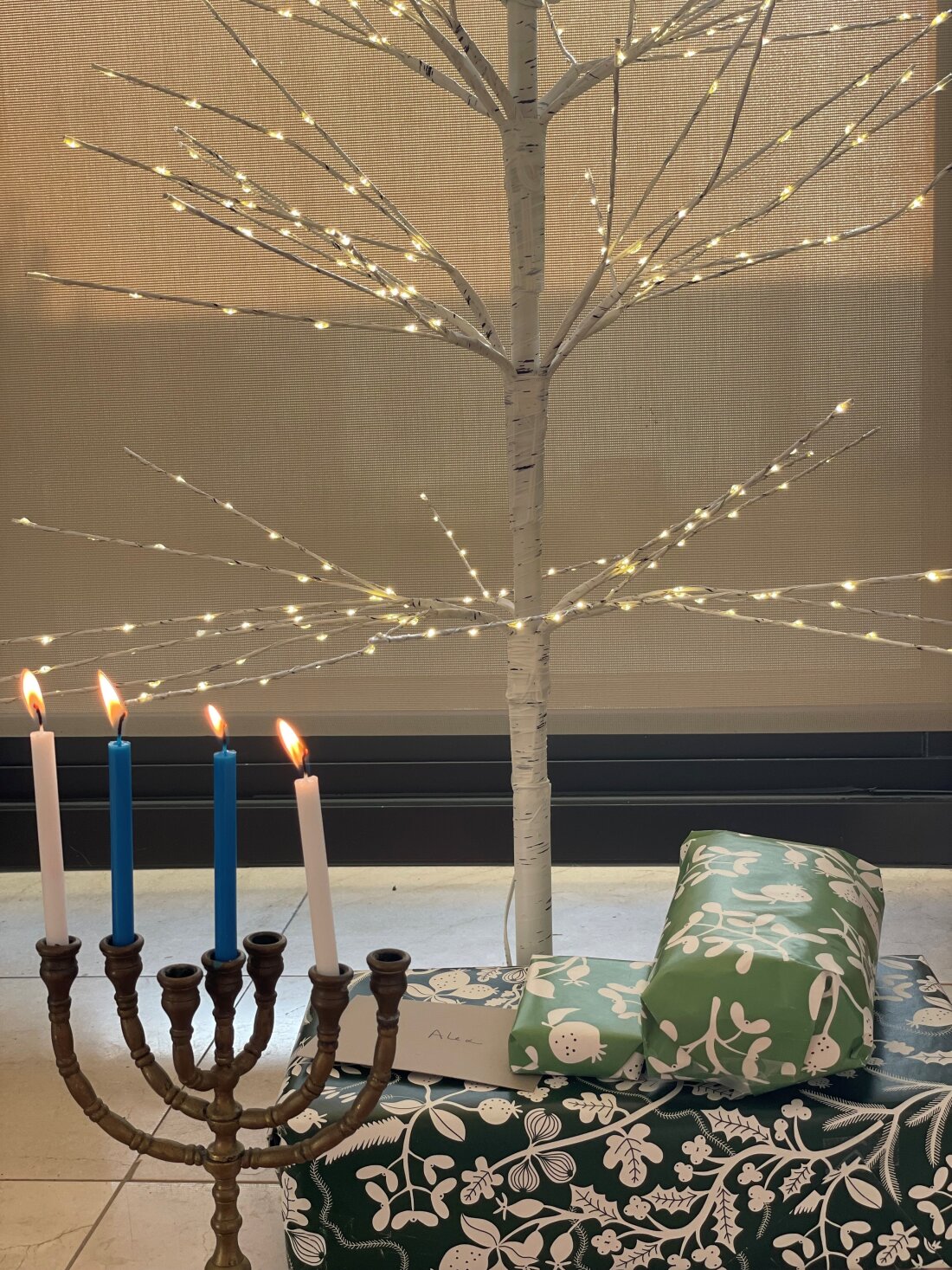 Scott Simon's Christmas tree and Hanukah candles.