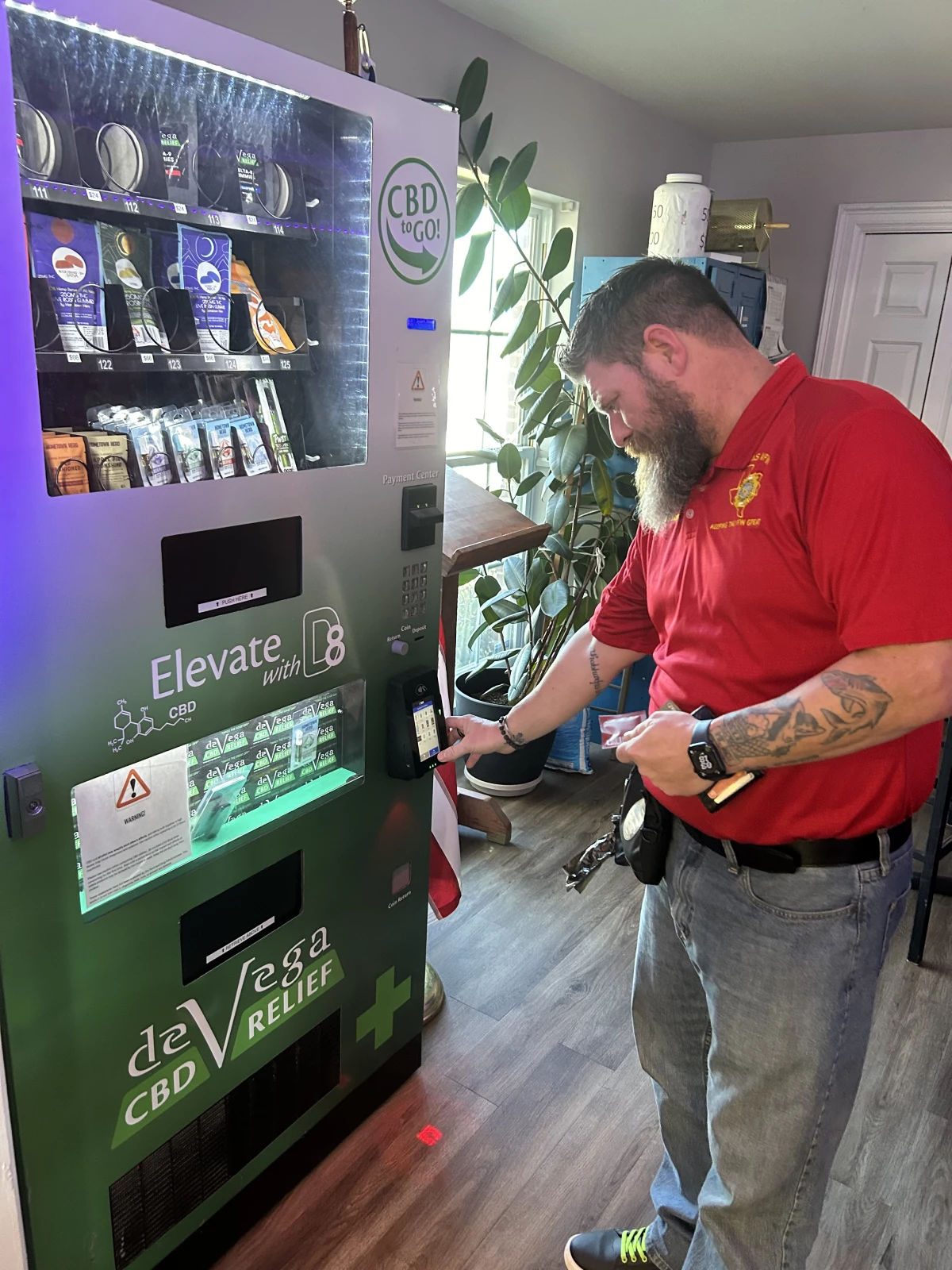 John Jowers, Assistant State Adjutant of the Texas VFW, uses a cannabis vending machine inside a VFW post near Austin. He supports an open market for cannabis products to treat veterans' PTSD.