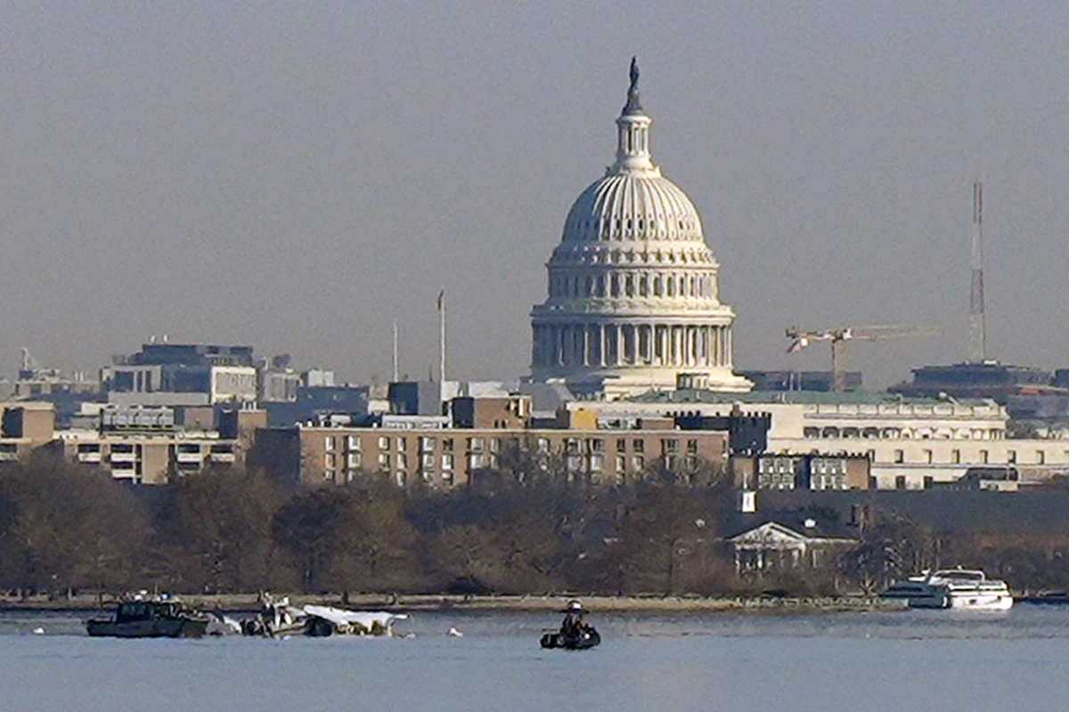 Search and rescue efforts are seen around a wreckage site in the Potomac River from Ronald Reagan Washington National Airport, early Thursday morning, Jan. 30, 2025, in Arlington, Va.