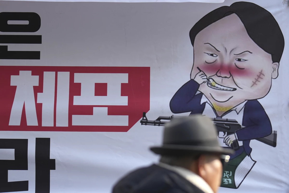 A caricature depicting South Korean President Yoon Suk Yeol is seen near the ruling People Power Party's head office in Seoul, South Korea on Monday.