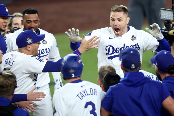 Freddie Freeman celebrates with teammates after hitting a walk-off grand slam during the tenth inning against the New York Yankees during Game One of the 2024 World Series.