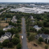 In an aerial view, various data centers are shown situated near a neighborhood on July 17, 2024 in Ashburn, Va. Northern Virginia is home to 319 mapped data centers — about 19% percent of the country’s facilities.