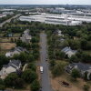 In an aerial view, various data centers are shown situated near a neighborhood on July 17, 2024 in Ashburn, Va. Northern Virginia is home to 319 mapped data centers — about 19% percent of the country’s facilities.