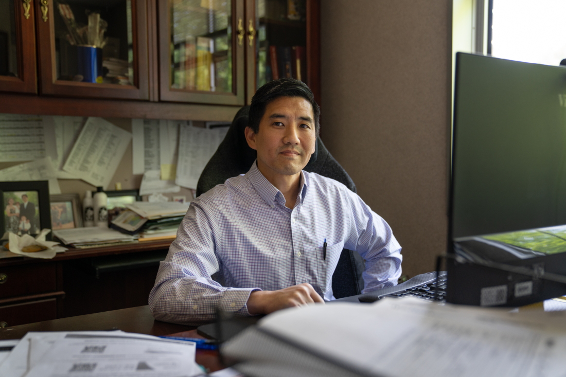 Dr. Jonathan Poon sits in his office at the Medical Center of Elberton.