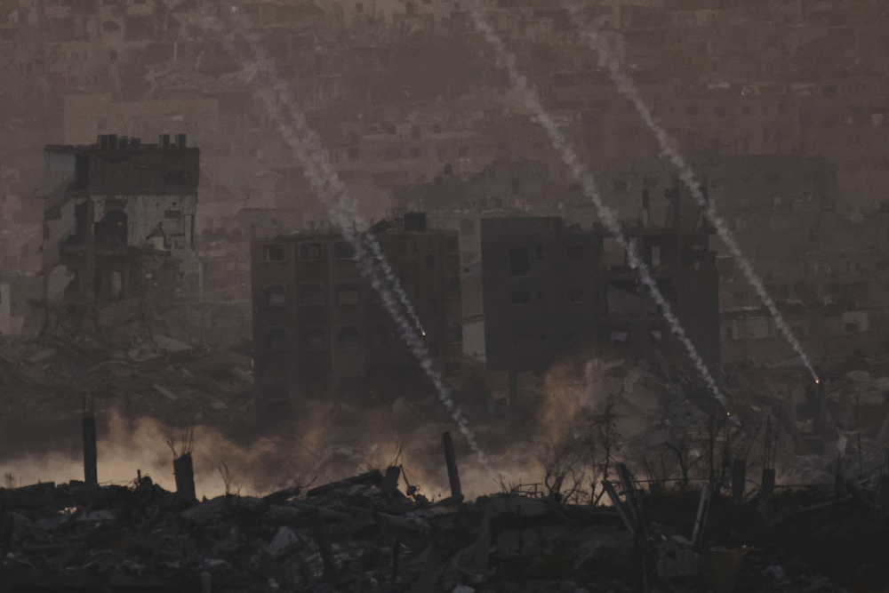 Israeli shelling hits an area in the northern of Gaza Strip as seen from southern Israel, Tuesday. (AP)