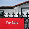 A 'for sale' sign is seen on a house in Monterey Park, California, on September 17, 2025.