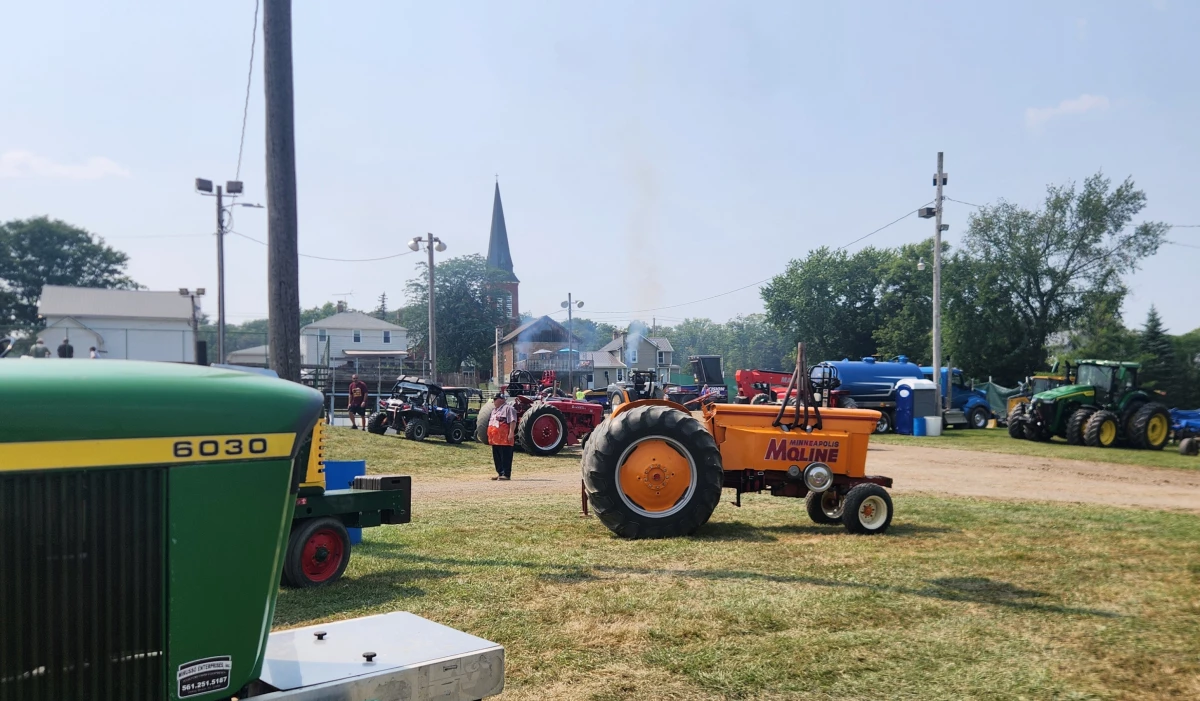 The tractor pull has competition categories for both heavily modified rides and for off-the-farm models like these.