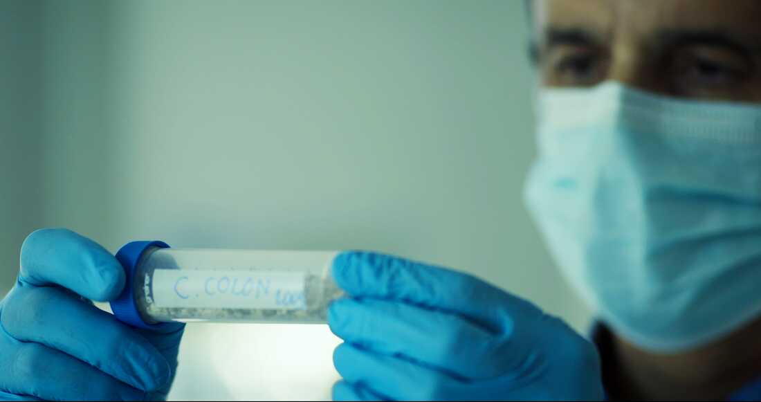 Forensic medical expert José Antonio Lorente examines DNA evidence in an image from the documentary Colón ADN, su verdadero origen.