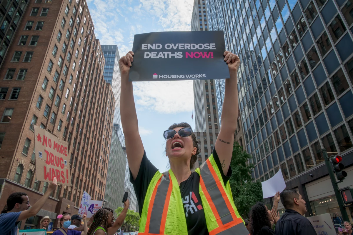 A protestor marks International Overdose Awareness Day in Manhattan last August. Overdose deaths were down in recent months, and Democrats are questioning the wisdom of changing policies that are show progress.