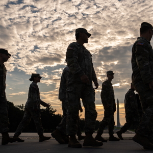 Members of the National Guard walk past the Lincoln Memorial Reflecting Pool before the March on Washington, Friday, Aug. 28, 2026, in Washington.