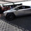 Visitors look over a 2024 Cybertruck in the Tesla display at the Electrify Expo, Sunday, July 14, 2024, in north Denver. The exposition was making its first stop in Denver as part of a countrywide effort to showcase the latest in a wide array of electric brands ranging from cars and trucks to bicycles and even skateboards. (AP Photo/David Zalubowski)