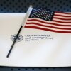 An information packet and an American flag are placed on a chair at the U.S. Citizenship and Immigration Services Miami Field Office on Aug. 17, 2018, in Miami.
