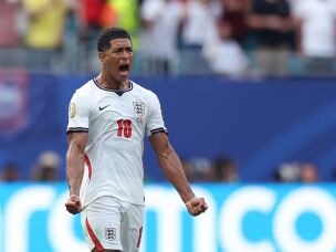 England's midfielder #10 Jude Bellingham celebrates after scoring the equalising goal during the 2026 World Cup football tournament quarter-final match between Norway and England at Miami Stadium in Miami Gardens on July 11, 2026.