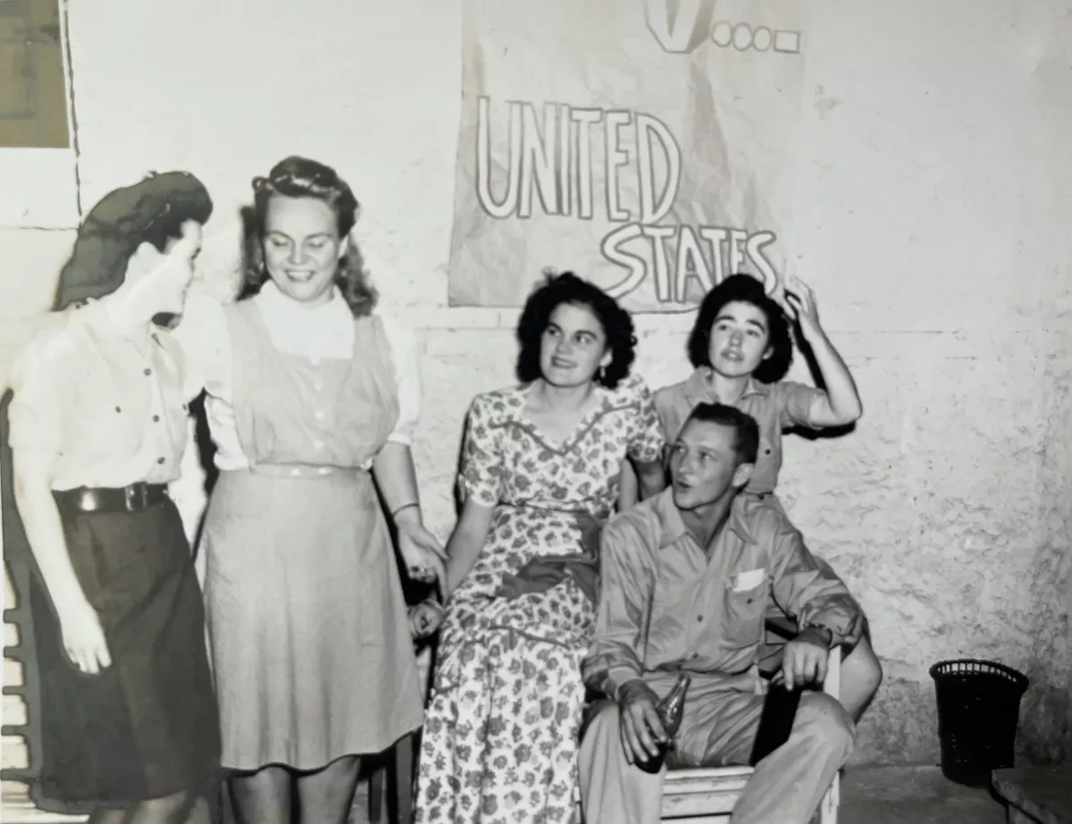 My mother (center in print dress) celebrating the Allied victory on May 5, 1945, the day Germany surrendered, ending the war in Europe.
