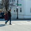 Afghani evacuees walk to a dentist appointment in Charlestown, Mass.