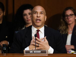 U.S. Sen. Cory Booker played tight end at Stanford from 1987 to 1990, when college football's big money era was just getting started. Now the New Jersey Democrat is working to shape landmark college sports legislation.