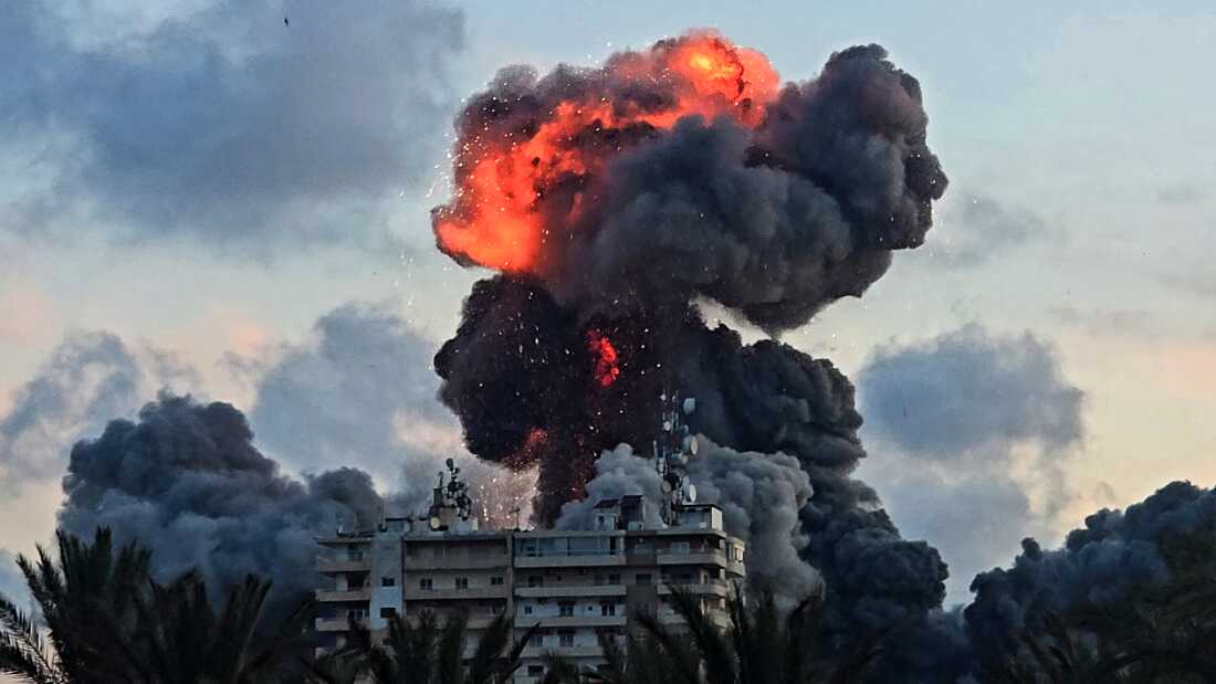 A fireball and smoke erupt from a building following an Israeli strike in Tyre, southern Lebanon.