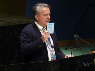 Sergiy Kyslytsya, Ukraine's then-ambassador to the United Nations, holds up the United Nations Charter as he speaks at the U.N. General Assembly for a special session on the war in Ukraine on March 2, 2022, in New York City.