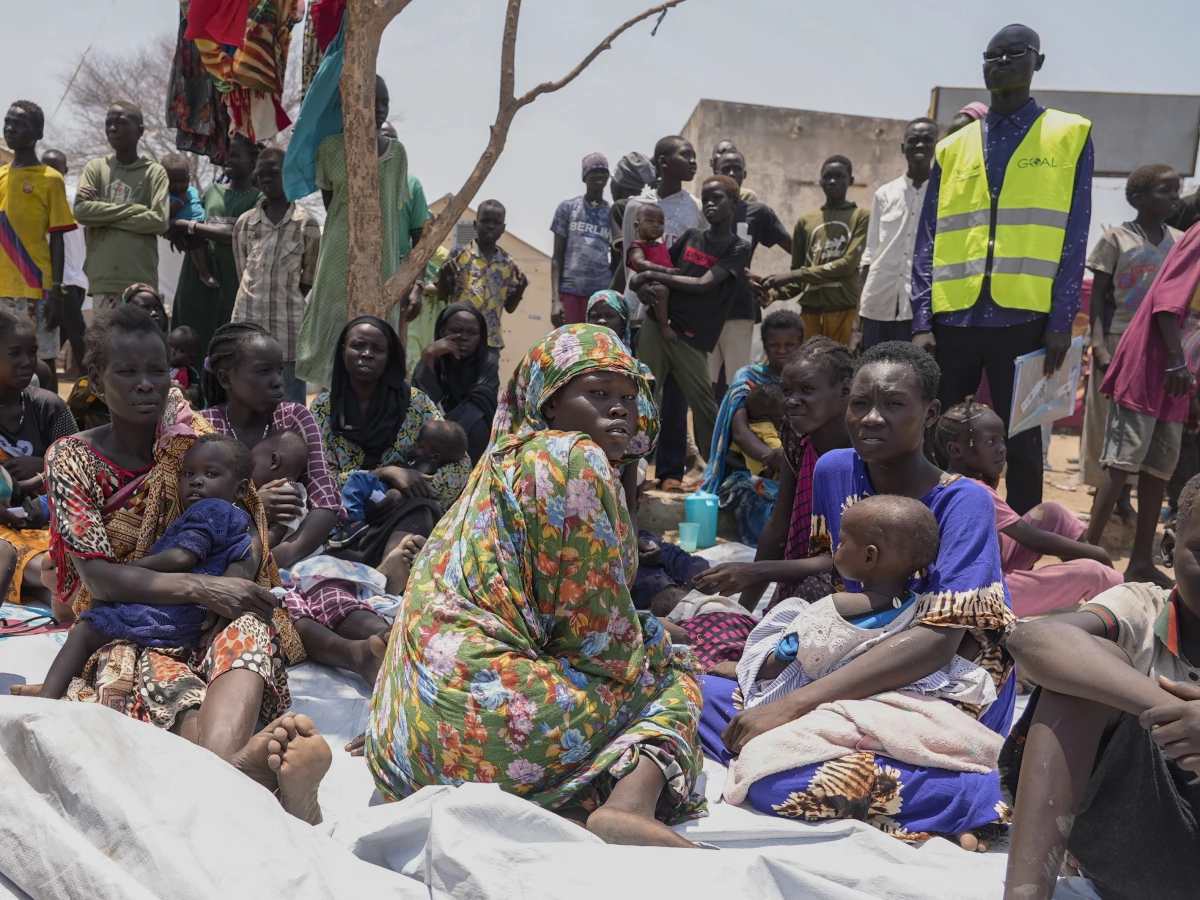 South Sudanese who fled from Sudan sit outside a nutrition clinic at a transit center in Renk, South Sudan, May 16, 2023. Fighting in Sudan has displaced 10 million people, according to U.N. figures.