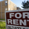 A "For Rent" sign displays outside an apartment building in Skokie, Ill., in 2024. Researchers from the Urban Institute found that a growing number of renters in the U.S. are struggling to pay for housing each month.