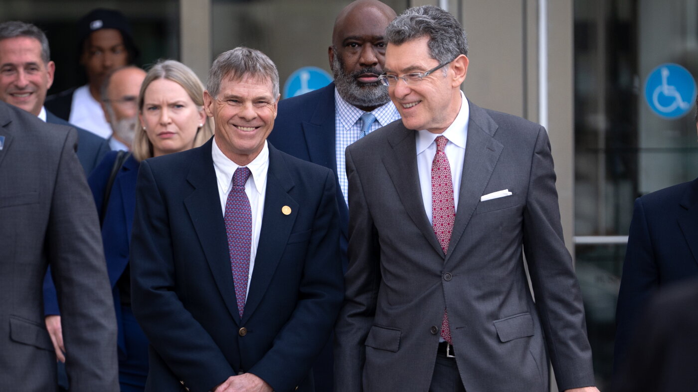 A judge permanently dismisses former Olympian's Reflecting Pool charges