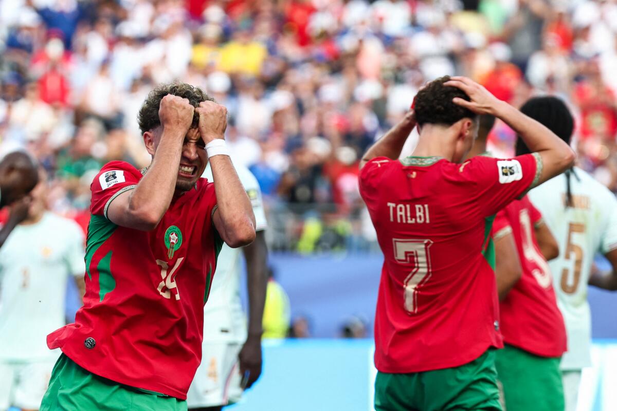 Morocco's midfielder Neil El Aynaoui (left) reacts to a missed chance during the World Cup match against France.