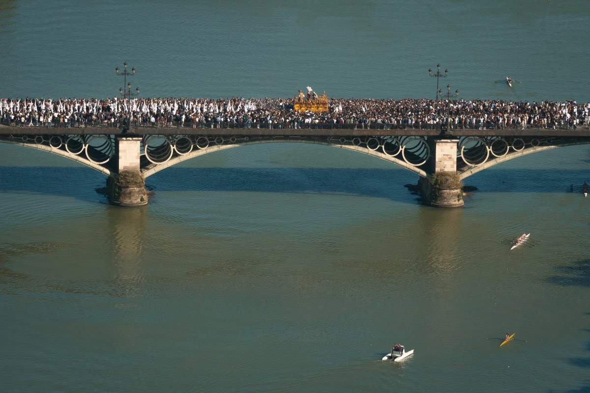 La Hermandad de San Gonzalo (Brotherhood of San Gonzalo) procesion crossing the Guadalquivir River during holy week on March 29, 2026 in Seville, Spain.
