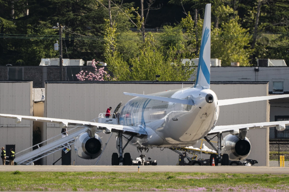 Detainees board a plane chartered by U.S. Immigration and Customs Enforcement (ICE) at King County International Airport on April 15, 2025 in Seattle, Washington. Semi-regular flights carrying detainees pass through the airport as the Trump administration continues to plan for the expansion of immigrant detention and deportation.