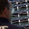 A trader works on the floor of the New York Stock Exchange (NYSE) on April 17, as the Dow was pressured by UnitedHealth Group's disappointing profit outlook. Over the past month, shares in the massive health care conglomerate have plunged more than 50 percent. (Photo by TIMOTHY A. CLARY/AFP via Getty Images)