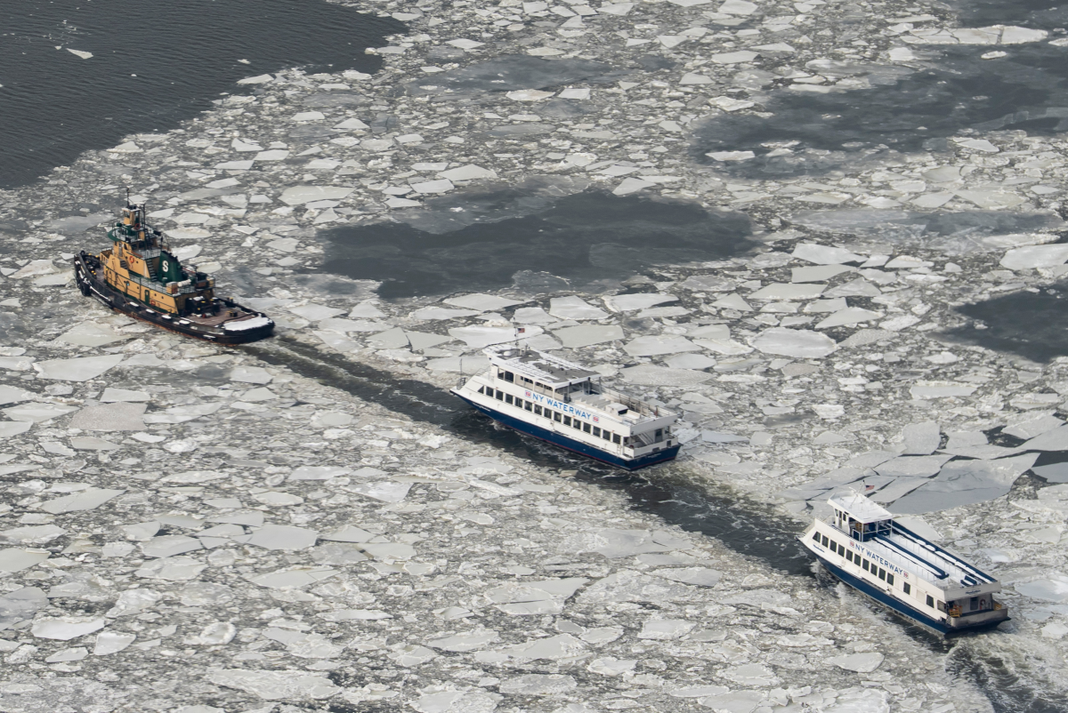 New York Waterway ferries move as ice floats on the Hudson River seen from the Edge sky deck at Hudson Yards on Tuesday.