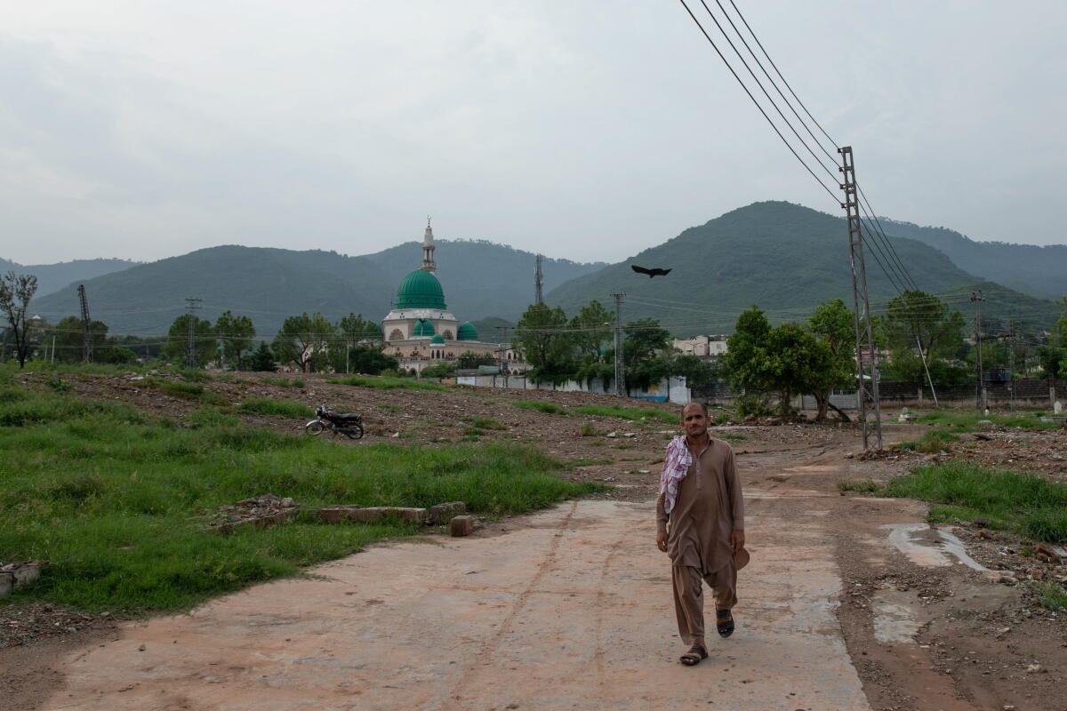 Houses were demolished near the green domed shrine to the Sufi saint Bari Imam.