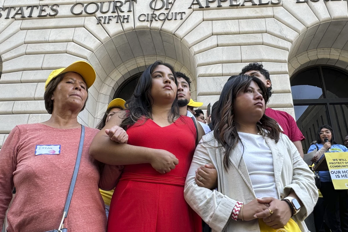 Supporters rally outside the 5th Circuit Court of Appeals in New Orleans on Thursday, Oct. 10, 2024, following a hearing on the future of the Deferred Action for Childhood Arrivals program. A separate lawsuit, filed in a federal district court in North Dakota, challenges a rule allowing DACA recipients to enroll in Affordable Care Act plans this year.